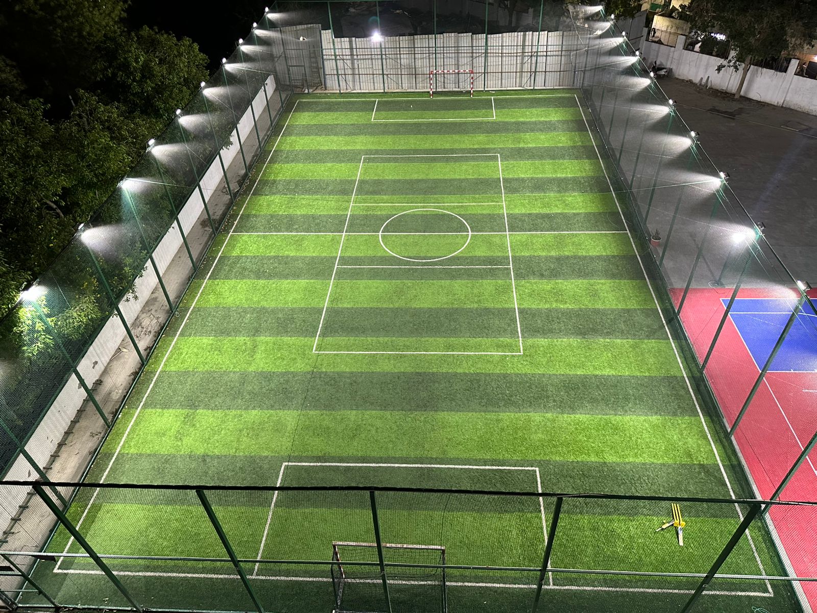 Evening Football Match on Floodlit Turf